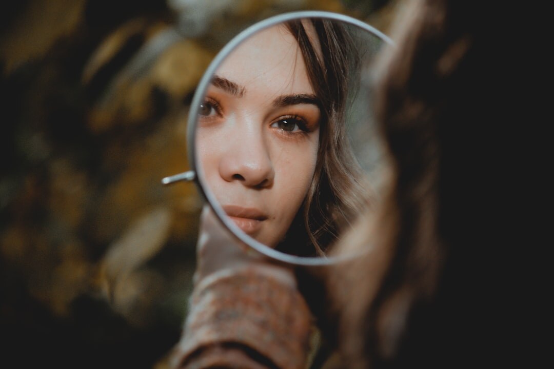 person reflecting in mirror