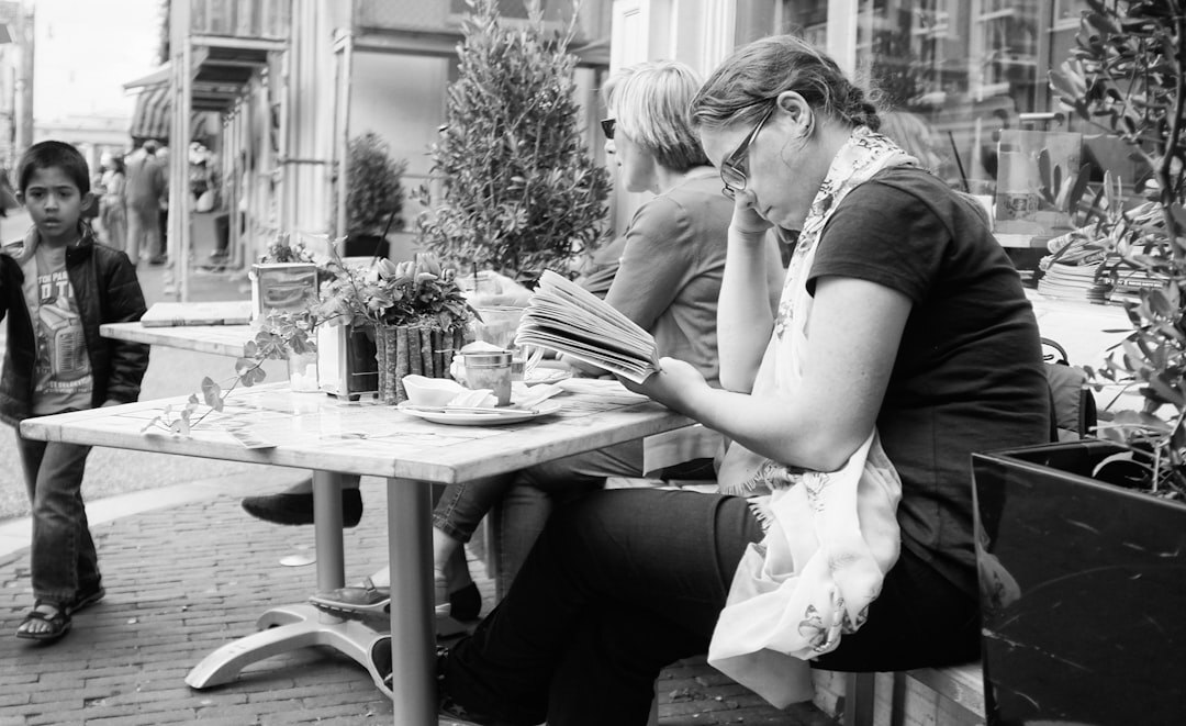 person journaling at cafe