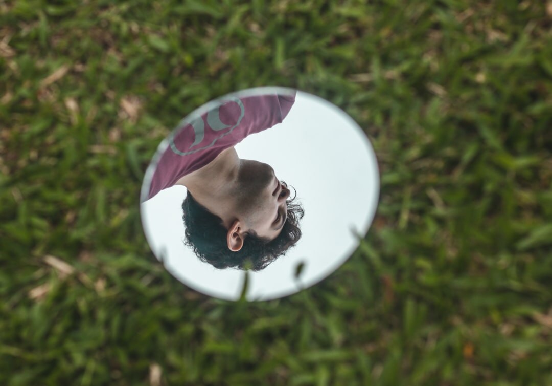 person reflecting in mirror